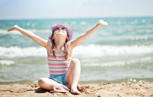 Girl playing in the sand in Myrtle Beach,SC