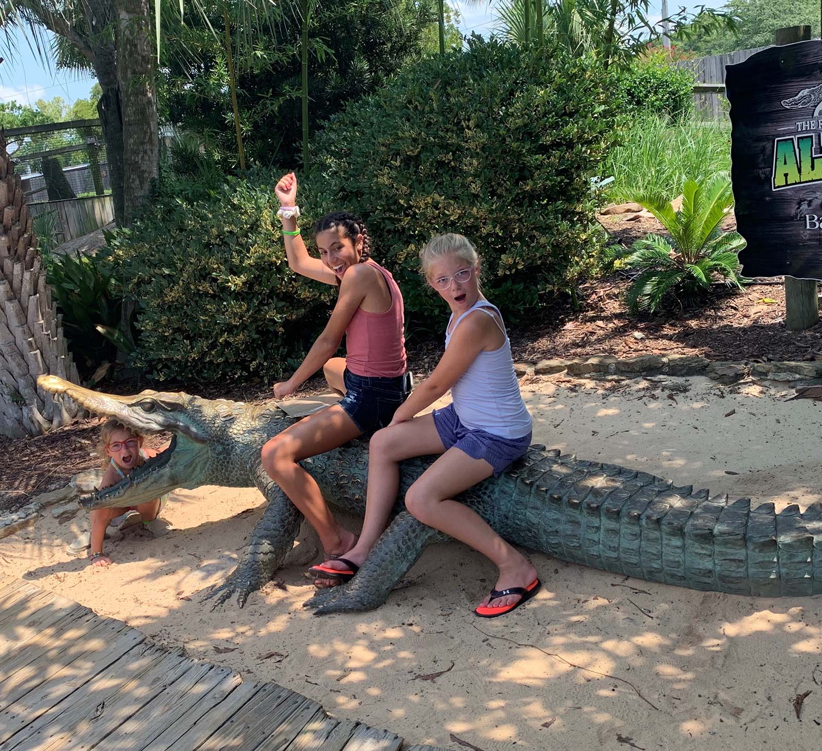 A couple riding an alligator in Myrtle Beach,SC