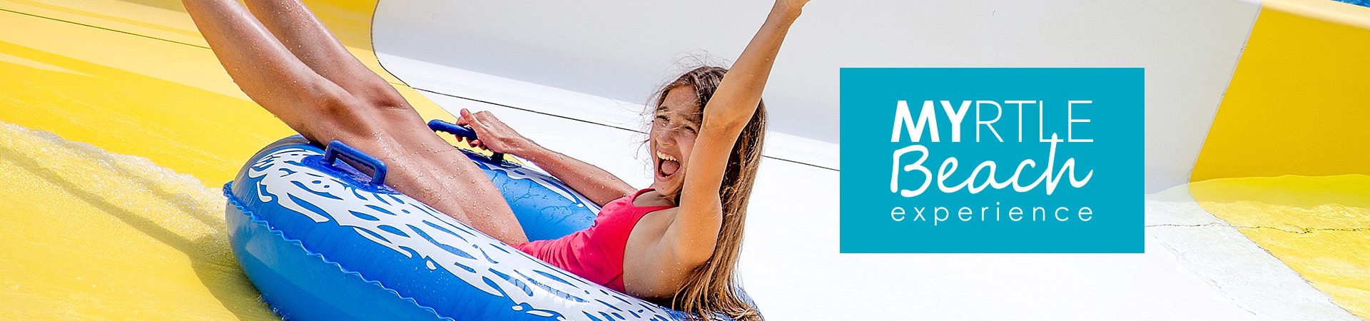 Girl having fun riding in a tube waterslide.