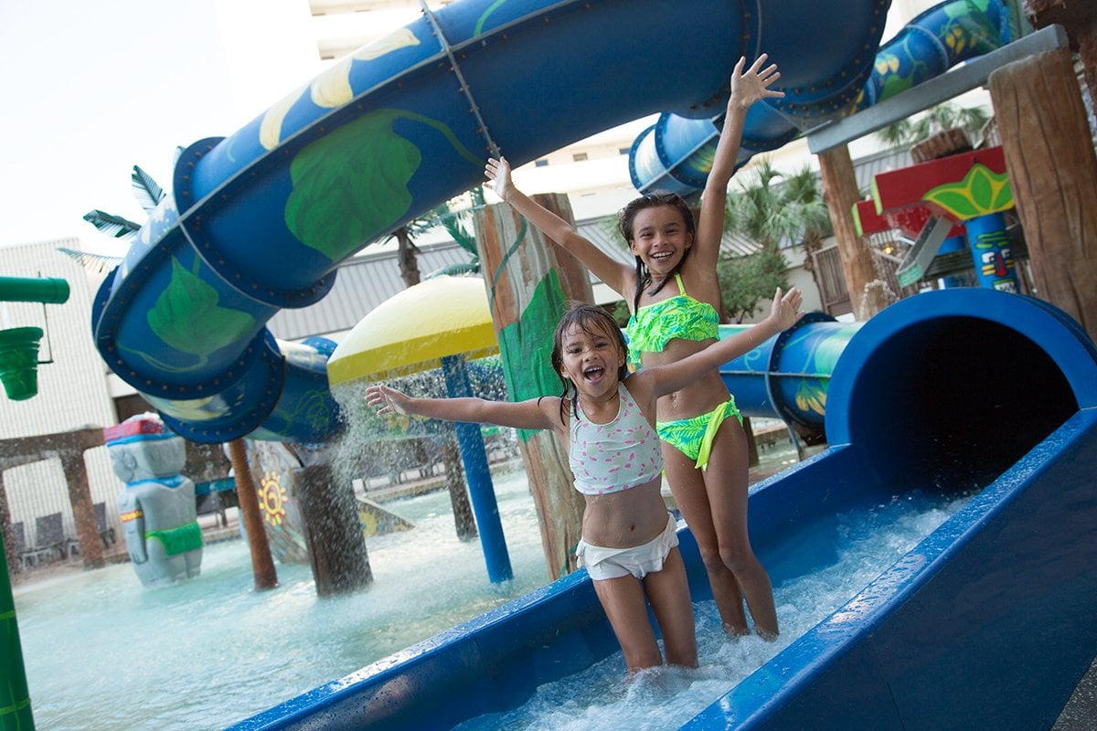 Girls at the end of a big slide at Ocean Reef Resort