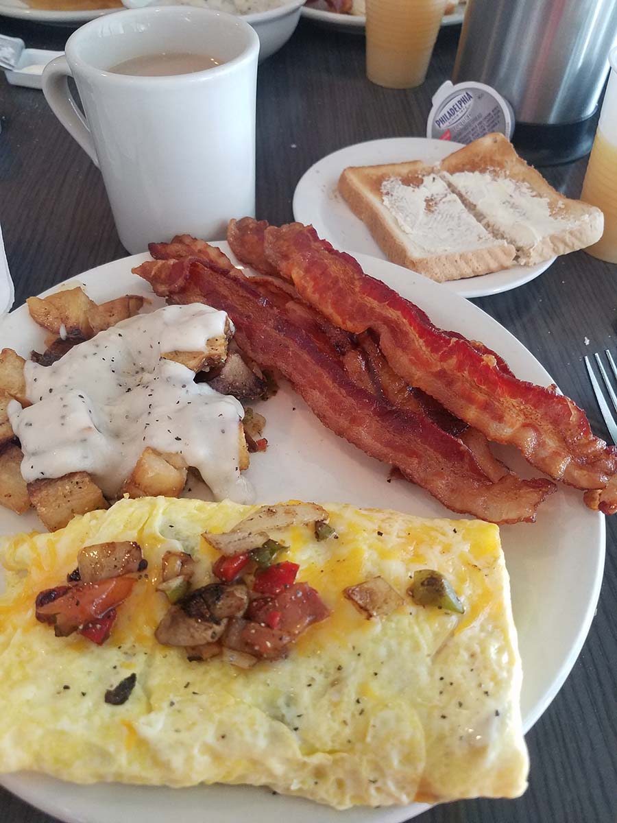 Breakfast plate with bacon and eggs at Paradise Resort
