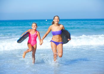 Children-Boards-At-Beach-shutterstock_168291251-scaled.jpg